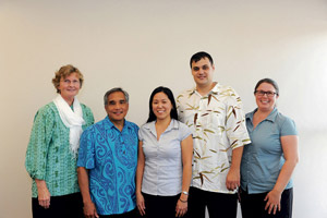 Dr. Neal Palafox (second from left) with the staff of Pacific Cancer . Programs: Jane Daye, Mavis Nitta, Michael Reiter and Tricia Torris. Lawrence Tabudlo photos ltabudlo@midweek.com
