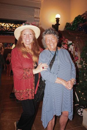 Elizabeth Freeman and Sue Dixon help light it up. Amanda C. Gregg photo