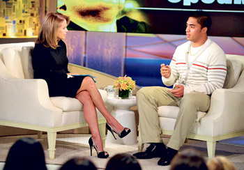 Manti Te'o, dressed to show calm in light colors and a non-threatening sweater, chats with Katie Couric. AP photo