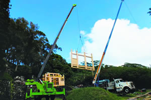 Conklinâ€™s cranes lift pieces of the new Lawai International Centerâ€™s Hall of Compassion into place. Lynn Muramoto photo