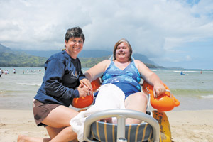 Whether it's helping people with disabilities enjoy ocean activities, advising those with brain injuries or offering speech and physical therapy, Suzie Woolway works to enrich the lives of others. Here she's pictured with stroke victim Karen Batis at Hanalei