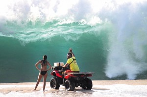 Lifeguard Kainoa McGee at Ke Iki Beach on Oahuâ€™s North Shore warns a beachgoer of the potential danger. Photo courtesy Vince Cavataio