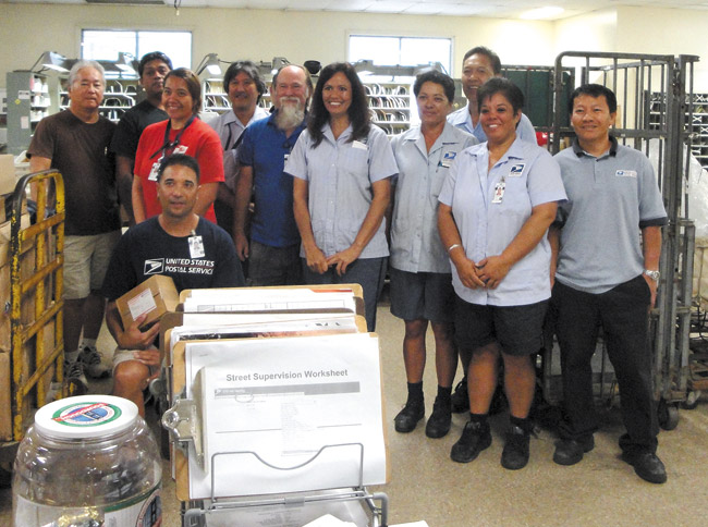 Kapaa Post Office staff celebrate after a big day of collecting donations for the food bank. Photo courtesy Hawaii Foodbank 