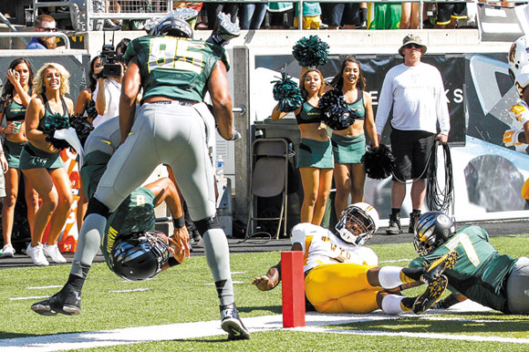 Marcus Mariota somersaults to a touchdown against Wyoming at Autzen Stadium Sept. 13  ERIC EVANS PHOTOGRAPHY