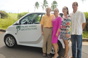 (from left) Palmer Hafdahl (architect and owner), Andrea Lincoln (architectural designer), Desi Kittredge (office manager) and Jon Lucas (draftsman) with Palms Hawaii Architecture's new electric vehicle. Photo courtesy Palms Hawaii Architecture