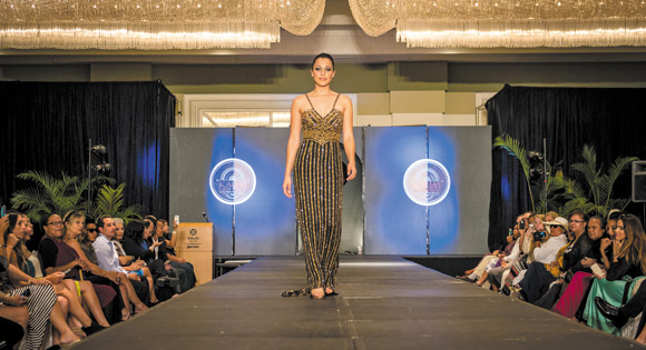 Stephanie Steuri, reigning Miss Hawaii, walks down the runway at last year's Kauai Fashion Weekend in one of Sha Ali Ahmad's designs. Photo courtesy of Patrick Kelley Worldwide photography 