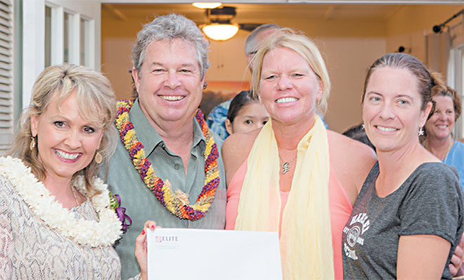 (from left) Danette Andrews and Sean Ahern of Elite Pacific Properties present a check for $2,000 to Hanalei Elementary art teacher Jennifer Gagen and Kari Derr of Hanalei PTSA | Photo by Lannie Boesiger