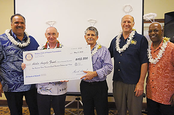 A check is presented to Aloha Angels president Ric Cox (second from left), pictured here with (from left) Mayor Bernard Carvalho Jr. and Rotary Club of Kapaa Foundation representatives Jim Saylor, foundation president, Ron Margolis, past club president, and Ronald Lemay, club president-elect Averie Soto photo