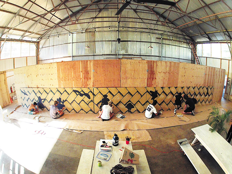 High school kids working on a lauhala mat wall PHOTO COURTESY OF SETH WOMBLE 