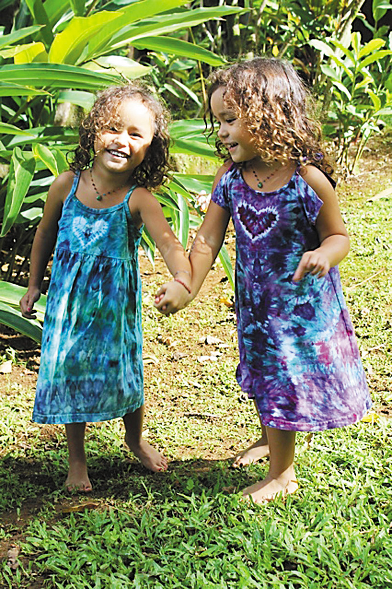 Shama and Cali Mahuiki, Jessica Drake's twin daughters, show off some of Jeseye Designs' tie-dye apparel for keiki (PHOTO COURTESY JESEYE DESIGNS) 