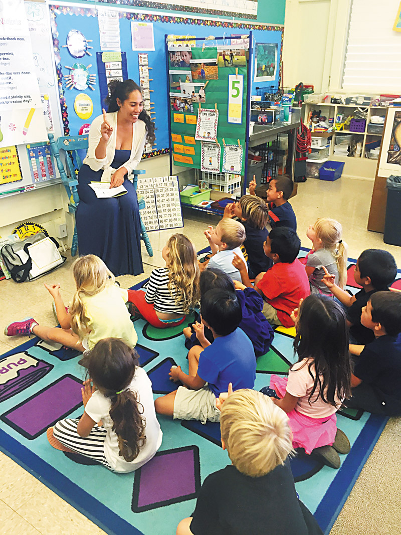 Ivory Lloyd visits an elementary school to help give keiki some basics about money 