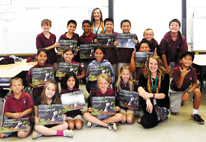 Carol Peacock-Williams with a class of elementary school students she recently visited for Read Across Kauai Day 