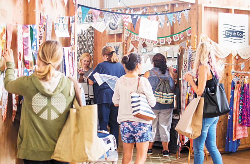 Shoppers check out what Ivy & Co. has to offer during Friday Market (Photo courtesy Warehouse 3540) 