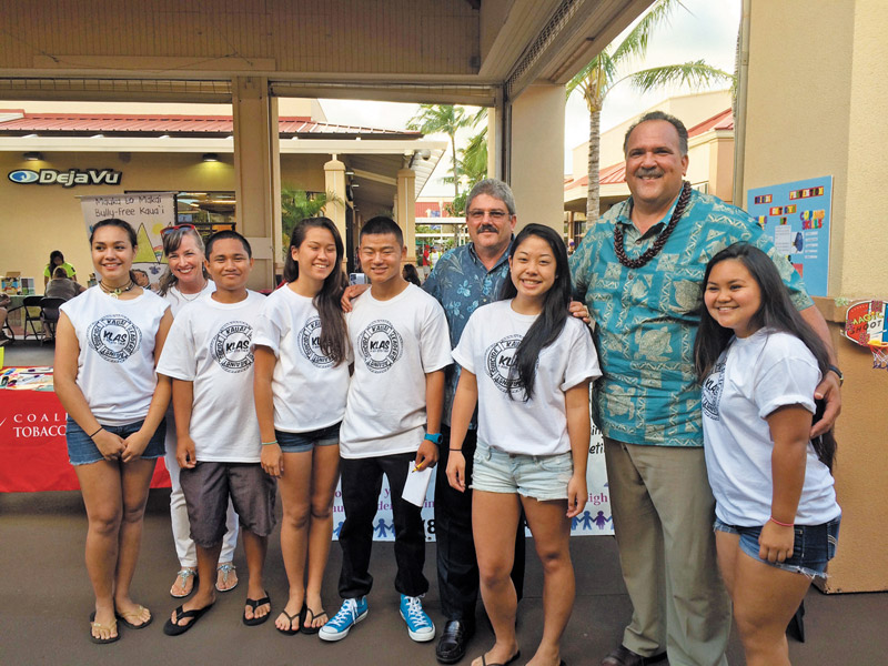 High school students Kiana Huffman, John Corbillon, Calcee Nance, Donovan Miyasato, Laura Koga and Brittnee Pablo, along with Bridget Arume, who volunteer their time to help inform others about suicide prevention, pose for a photo with Mayor Bernard Carvalho Jr. and Kauai County Council Chairman Mel Rapozo PHOTO COURTESY PREVENT SUICIDE KAUAI TASK FORCE 
