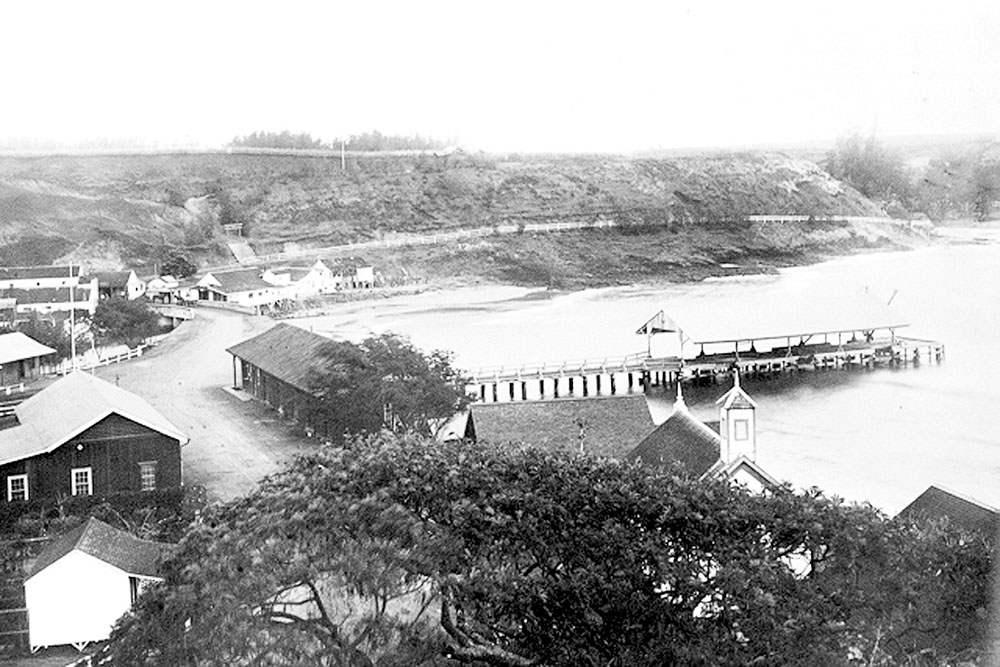Photo of Nawiliwili Pier from 1915 shows the old dock area before construction of the breakwater and new dock. This is one of the many photos in its collection KHS now has digitized.
