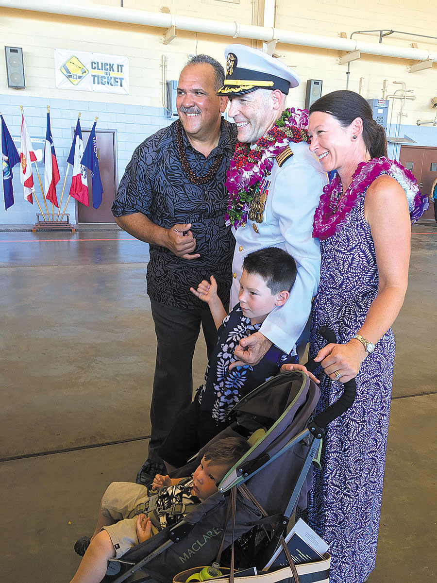 Mayor Carvalho welcomes Capt. Vincent R. Johnson, wife Marcia and children Henry and Sam. PHOTO COURTESY PMRF