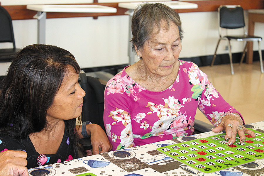 Josie Pablo connects with all the residents at SMMH, including Margaret Ponce, pictured here playing bingo