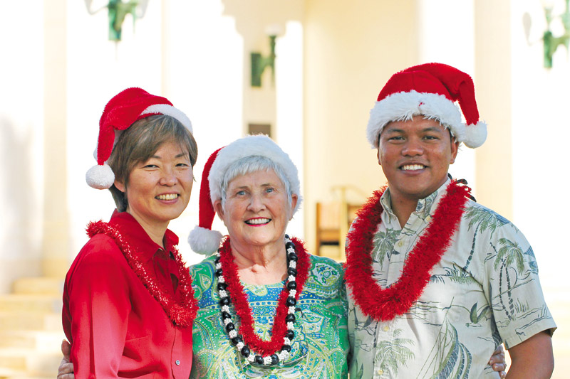 Lani Nagao, Eileen Winters and Addison Bulosan of the Rotary Club of Kauai pose for a photo where the parade route culminates at the Historic County Building (Coco Zickos photo) 