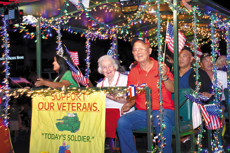 Kauai veterans celebrate the holidays on a float they created for the Lights on Rice parade 