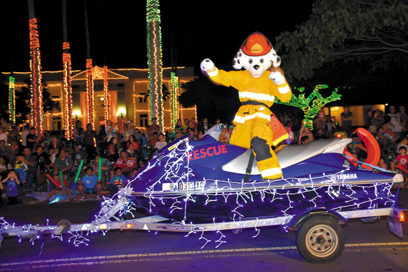 Even Sparky the Fire Dog gets his own fl oat at Kauai's Lights on Rice Parade