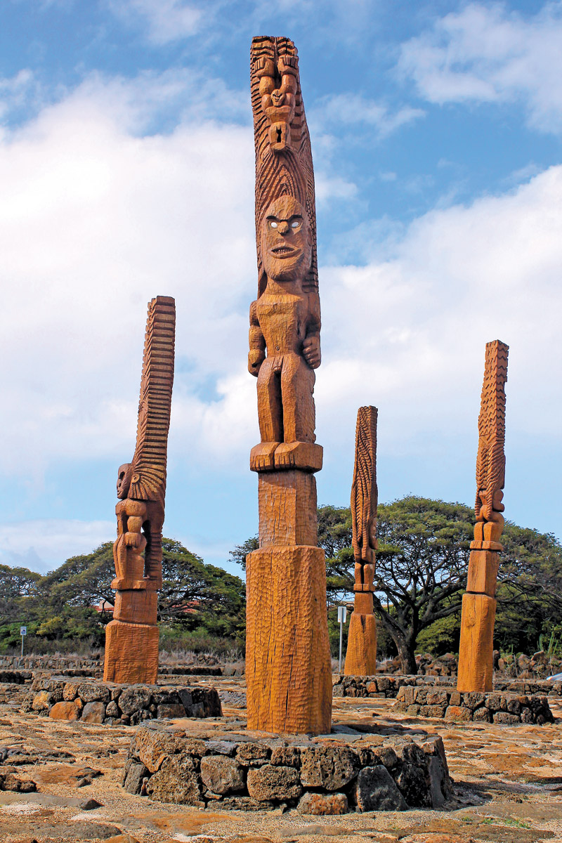 Four kii, representing Hawaiian gods Kane, Ku, Lono and Kanaloa, watch over the site COCO ZICKOS PHOTO 