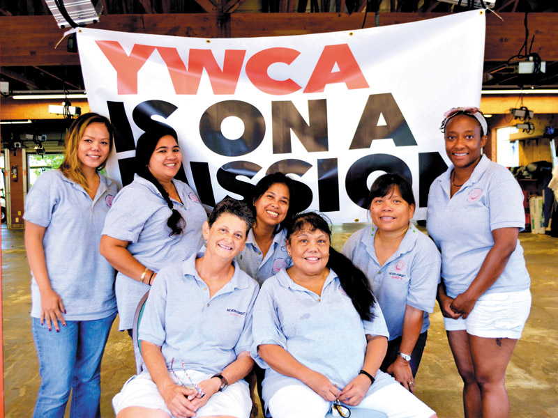 Jamie Bucuo, Gemmalyn Starr, Renae Hamilton, Hilda Javier, Janie Meyers, Dollie Galiza and Rozetta Williams participating in YWCA's ‘Never Forget Sandy G,' an annual fundraiser held in honor of a woman who tragically died from domestic violence 