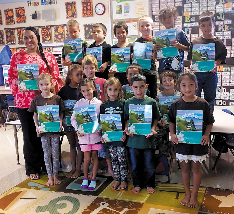 Mele Cachero and her first-grade class at Kanuikapono Charter School in Anahola with their ‘Aloha' books 