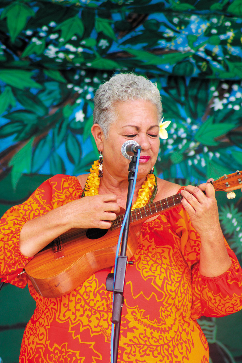 Lady Ipo Kahaunaele-Ferreira performs for the audience at a past Anahola Prince Kuhio Day Celebration 