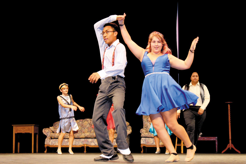 Ethan Combs and Maya Clark swing dance in the play