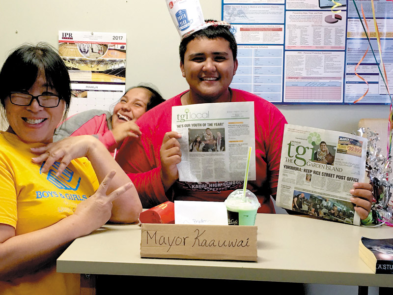 Bryden Ka‘auwai celebrates after winning Youth of the Year for the Boys & Girls Club of Hawaii, which includes clubs on Oahu and Kauai. Asaka Herman, Lihue Clubhouse director, and Sadie Gonsalves, BGCH Lihue member, have fun with Ka‘auwai by pretending he's already been elected mayor of the county
