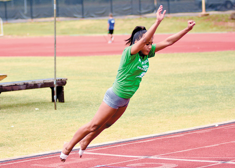 Kapaa Middle's Keala Contrades launches in the standing long jump 