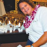 Dr. Heather Hopkins snuggles with a litter of stuffed