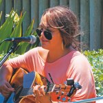 Iris Downey sings at open mic by the pool