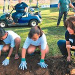 Waimea Canyon Middle students and Michele Saito get down and dirty