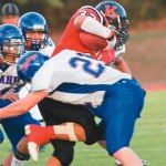 Travis Koga takes a hit from Kalaheo