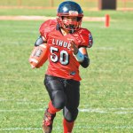 Cal Koga heads for the end zone