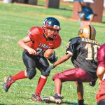 James-Ian Ilae makes a cut as Logan Kanahele-Shintani (10) moves in for the tackle