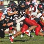 Darren Acoba stretches the Iolani defense