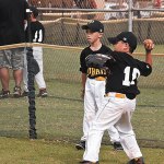 Dylan Date makes a long throw from the fence
