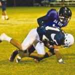 Kaua‘iâ€™s Patrick Tacata brings down Kia Hale after a catch