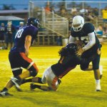 Chris Mundon tackles Oahu quarterback Andrew Kamanas