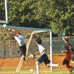 KHS goalie Dylan Snyderâ€™s acrobatic leap just misses a penalty kick from Caleb Licke in the first half