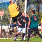 Afterburner goalie Juan Saenz skies to grab the approaching cross as Kevin Celebrado and Kryptoniteâ€™s Christian McKeown look on.