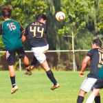 Afterburnerâ€™s Leroy Emery beats Duncan McDonald to the ball.