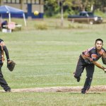 Outlaw shortstop Will Sasil guns a throw to first as third baseman Joey Hashimoto looks on.