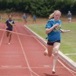 Allison Culliney of Island School crosses the finish line first after anchoring her squad in the 440-yard relay.