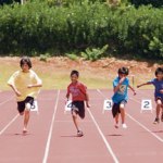 Runners sprint down the track during the boysâ€™ sixth and seventh grade 50-yard dash.