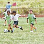 A Team Onipa‘a defender attempts to steal the ball from her opponent