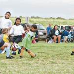 The Onipa‘a goalkeeper picks up a loose ball to deny her opponentâ€™s advance.