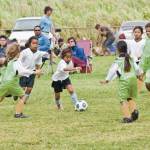 A shifty Onipa‘a attacker enters a crowd of eager Makani Gold defenders.